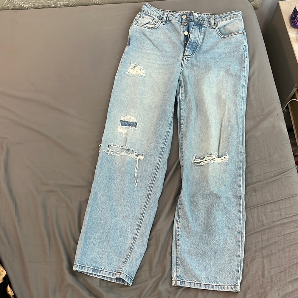 Blue jeans with cuts in them from Forever 21